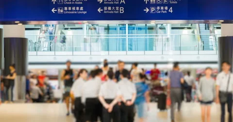4k time lapse video of commuters in an airport Stock Footage 64773009