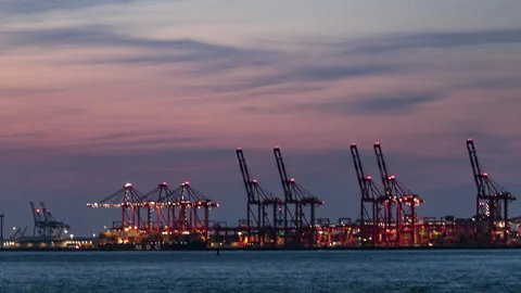 4K time lapse video of dusk over Liverpool container port cranes, England Stock Footage 308938432