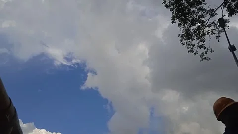 4K Time Lapse Video of Gray Clouds Moving Against a Blue Sky Background Stock Footage 309306966