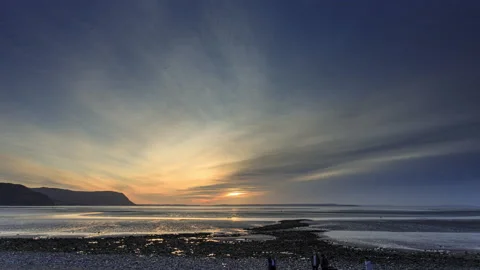 4K time lapse video of a lovely winter sunset over the North Wales coast Stock Footage 233992110