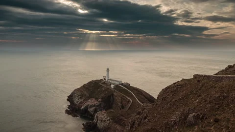 4K time lapse video of sunset over South Stack, Anglesey 스톡 동영상 306958986