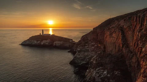 4K time lapse video of sunset over South Stack lighthouse, Anglesey, North Wales Stock Footage 312932411