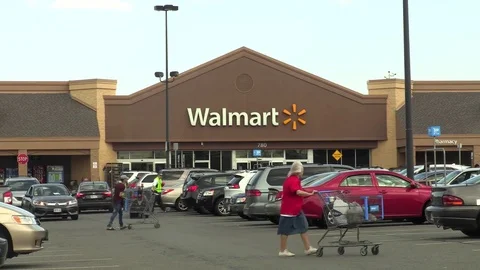 4K Time Lapse Walmart storefront parking lot customers Stock Footage 74748297
