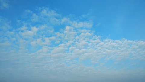 4k Time Lapse White clouds running over blue sky Stock Footage 97796991