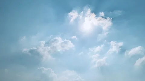 4K Time-Lapse of White Clouds Moving Across Blue Sky with Sunlight Stock Footage 342336084