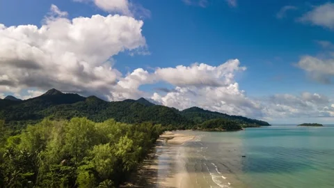 4k time-lapse of white sand beach, mountains with fast moving cloads Stock Footage 160709788
