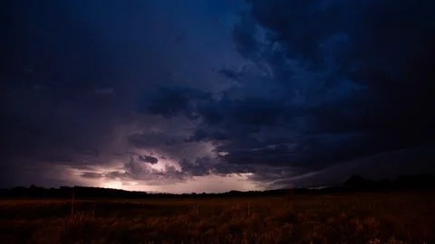 4K Time lapse wide shot of a thunderstorm above a field in Oklahoma at dusk Stock Footage 116751285