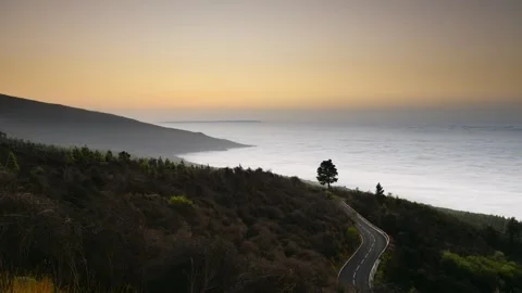 4K time lapse winding Mountain Road Above Sea of Clouds at Sunset Stock-Footage 329671144