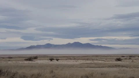 4K time lapse of a winter dust storm blowing across open plains in Arizona Stock Footage 229164157