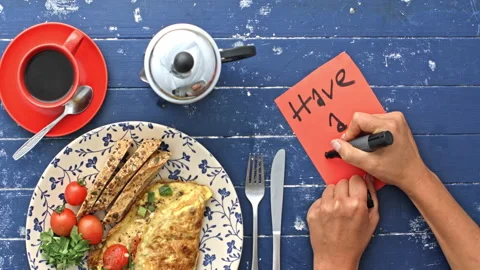 4k Time lapse of of woman's hands preparing breakfast omelette and writing note Stock Footage 199615842
