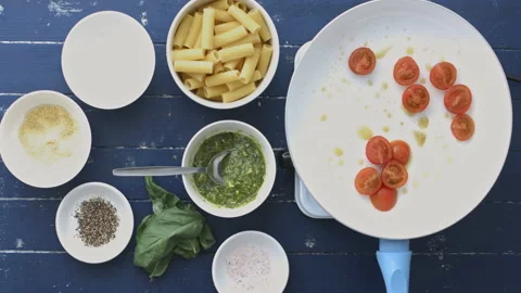 4k time lapse of woman's hands preparing and making basil pesto pasta salad on s Stock Footage 199615983