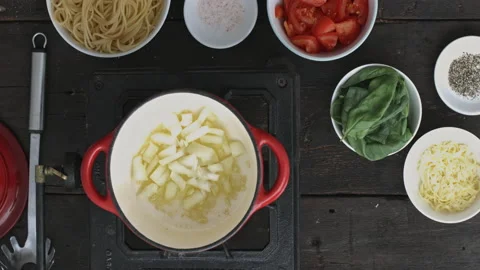 4k time lapse of woman's hands preparing vegetarian organic Italian spaghetti wi Stock Footage 199616074