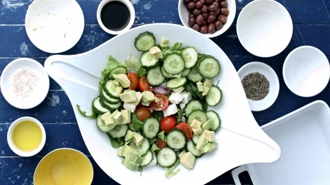 4k Time lapse of woman's hands preparing and making a Greek salad recipe. Stock Footage 199616375