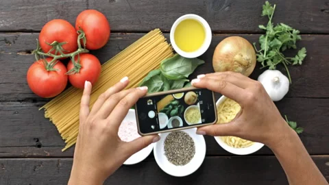 4k Time lapse of woman's hands taking picture of Italian vegetarian pasta ingred 動画素材 199616445