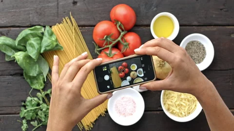 4k Time lapse of woman's hands taking picture of Italian vegetarian pasta ingred Stock Footage 199616467
