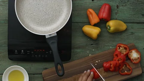 4k Time lapse of woman's hands preparing, cutting and fraying peppers on digital Video stock 199616535