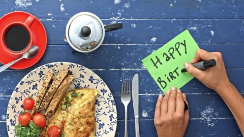 4k Time lapse of of woman's hands preparing breakfast omelette and writing happy Stock Footage 199616933