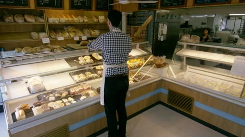 4K Time lapse workers &amp; customers in busy bakery shop Stock Footage 67726275
