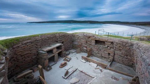 4K Time Laspe at Skara Brae Overlooking House 1 and the Beach in Sandwick Orkney Stock-Footage 253322364