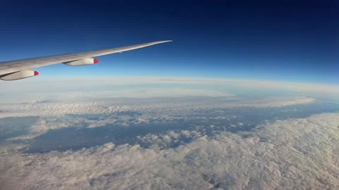 4K, Timelaps of beautiful clouds from above, as seen through airplane window-Dan Stock Footage 134279917