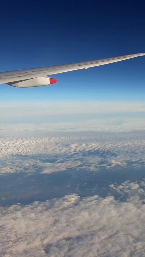 4K, Timelaps of beautiful clouds from above, as seen through airplane window Stock Footage 317332574