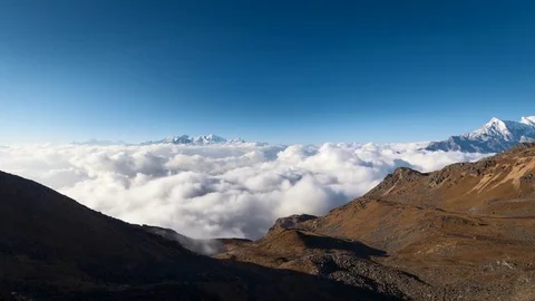 4K Timelapse - Above moving clouds until sunset with beautiful color change Stock Footage