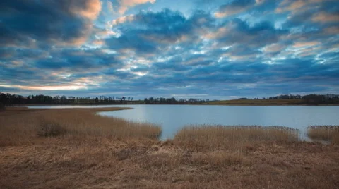 4k timelapse of after sunset cloudy sky over lake at springtime Stock Footage 60693369