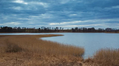 4k timelapse of after sunset cloudy sky over lake at springtime 動画素材 60693651