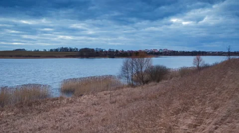 4k timelapse of after sunset sky over lake and distant city Stock Footage 60693766