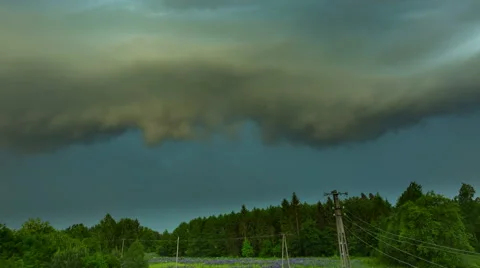 4k timelapse of aproaching storm with shelf cloud over rural landscape Stock Footage 63615478