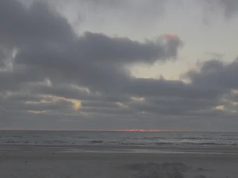 4k timelapse of a beach with clouds passing by during sunset Video stock 75084636