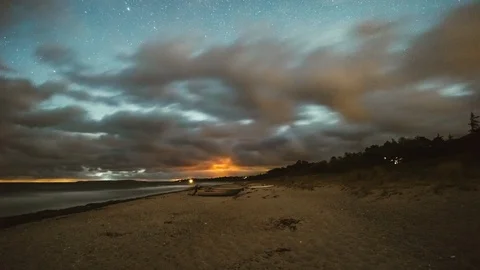 4K Timelapse Beach Stars &amp; Clouds Overhead in Denmark Stock Footage 111668146