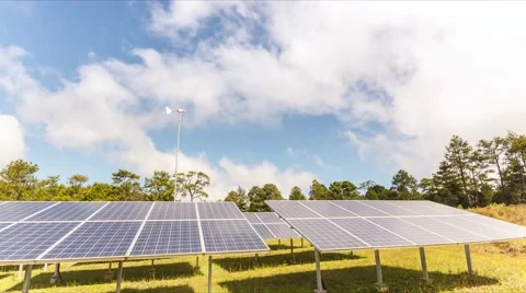 4K Timelapse, Beautiful cloudscape the solar panels and wind turbine, Stock Footage 61097641