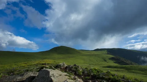 4k timelapse of beautiful high mountain grassland, with fast moving clouds Stock Footage 66183847