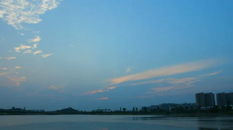 4k timelapse of beautiful sunset clouds over a lake Stock Footage 50198173
