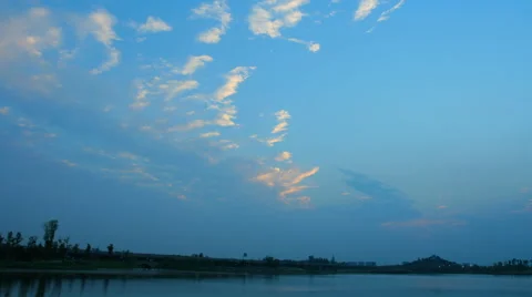 4k timelapse of beautiful sunset clouds over a lake Stock Footage 50198811