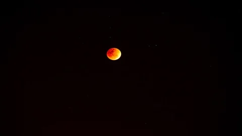 4K timelapse of blood moon during lunar eclipse of 2018 Stock Footage 99532283