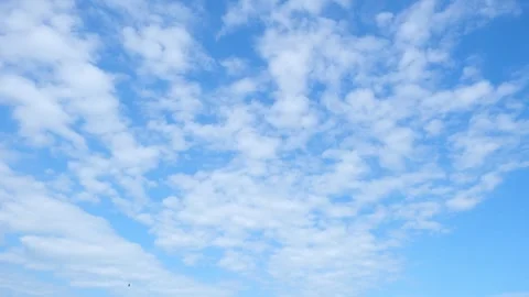 4K: Timelapse of the blue sky with white clouds, Time-lapse footage.  Stock Footage 303539473