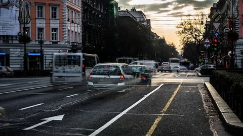 4k timelapse of a busy intersection with tram and traffic budapest daylight Stock Footage 70260730