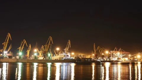 4K Timelapse, cargo ship moving load at port of Odessa. Night Time lapse Stock Footage 79348408