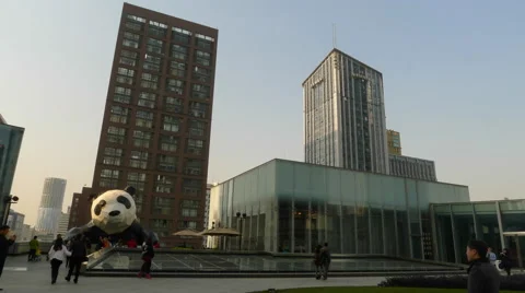 4k timelapse of Chunxi road central business district,and the giant panda statue Stock Footage 45388995
