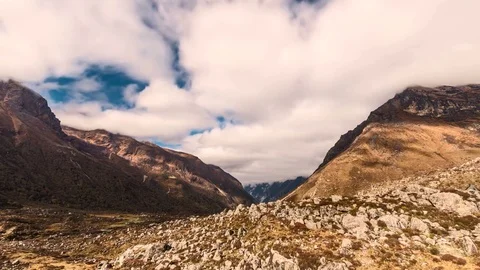 4K Timelapse of clouds and their shadows in a valley painting the scenery Stock Footage 79918035