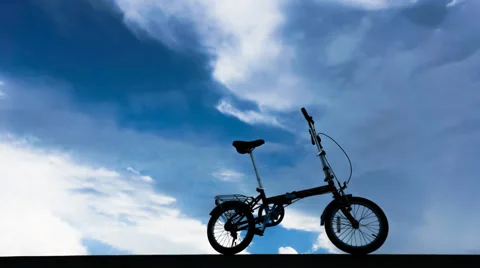 4K. Timelapse clouds bicycle Stock Footage 33548245