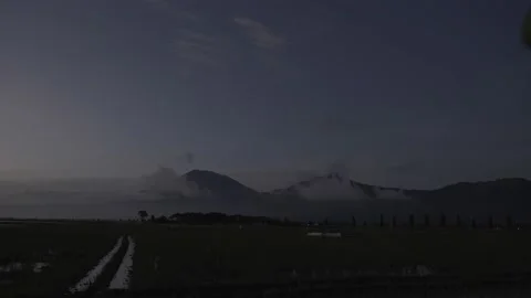4K Timelapse  clouds cover the mountains sunrise Stock Footage 222507060