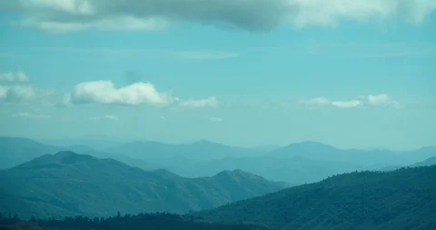 4k Timelapse of clouds forming over beautiful mountain valley Stock Footage 105494446