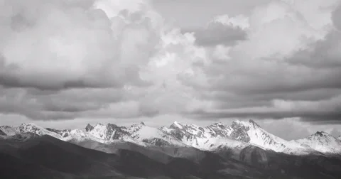 4k timelapse clouds mass rolling over Tibet snow-Covered mountains. Stock Footage 45510660