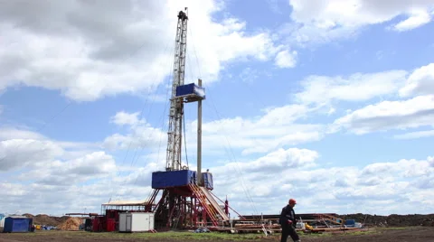 4K Timelapse clouds over drilling rig Stock Footage 63392625