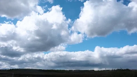 4K. Timelapse clouds over the green field Stock Footage 75527177