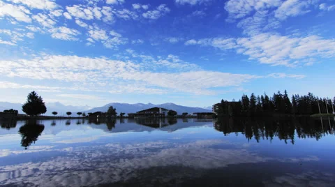 4K timelapse of Clouds over a mountain lake Stock Footage 55767453