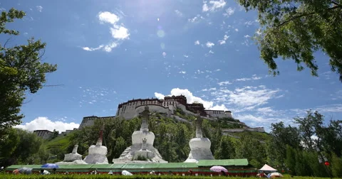 4k timelapse clouds rolling over Potala &amp; white stupa. Stock Footage 45146654